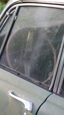 A vertical view of a car dashboard with clear, dry glass and no condensation