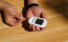 Checking for moisture under flooring with a handheld meter